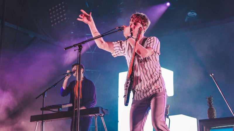 Band performing a concert with low camera angle