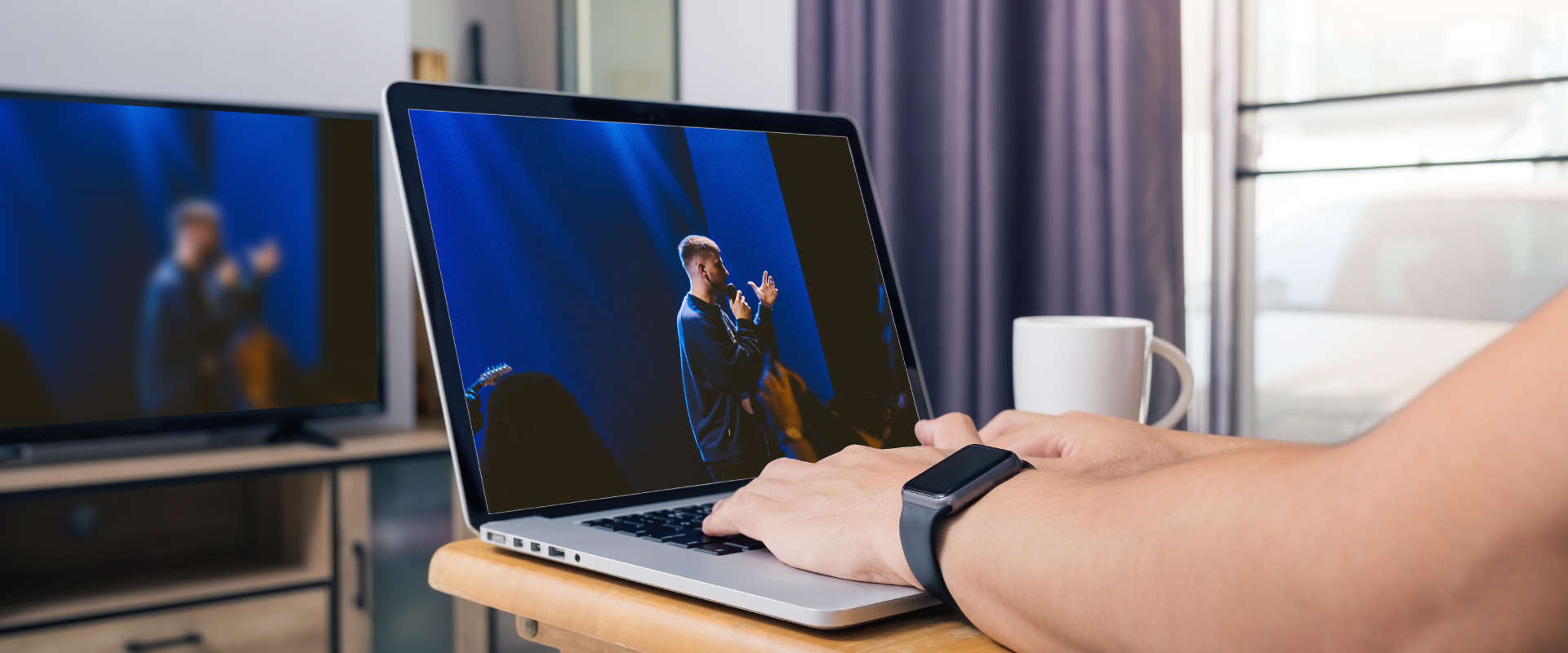 Person casting a church live stream to smart TV from laptop