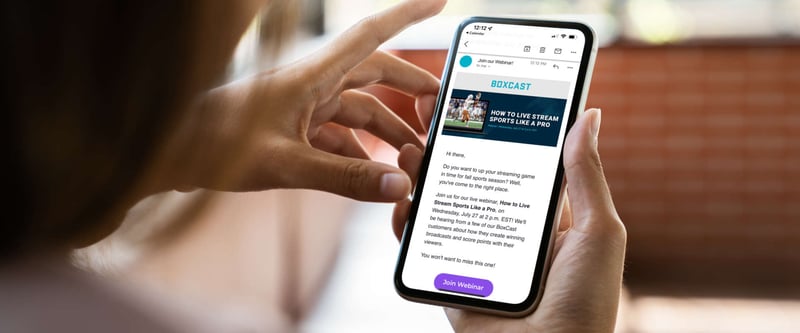 Person checking email on their phone with a live stream message