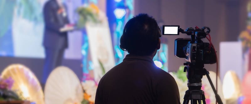 Camera operator filming a live church service