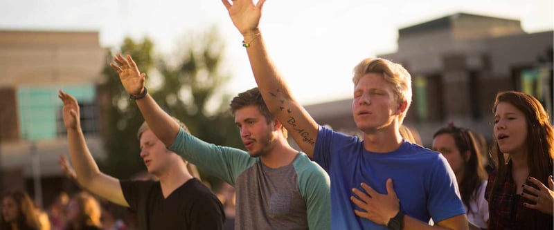 Church attendees at a worship service outside