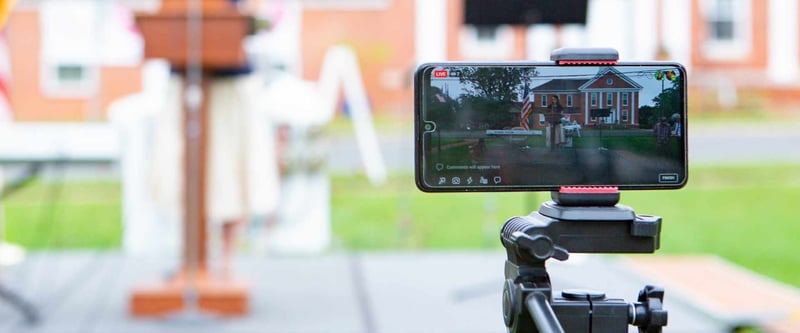 Phone outside on a tripod live streaming an outdoor event