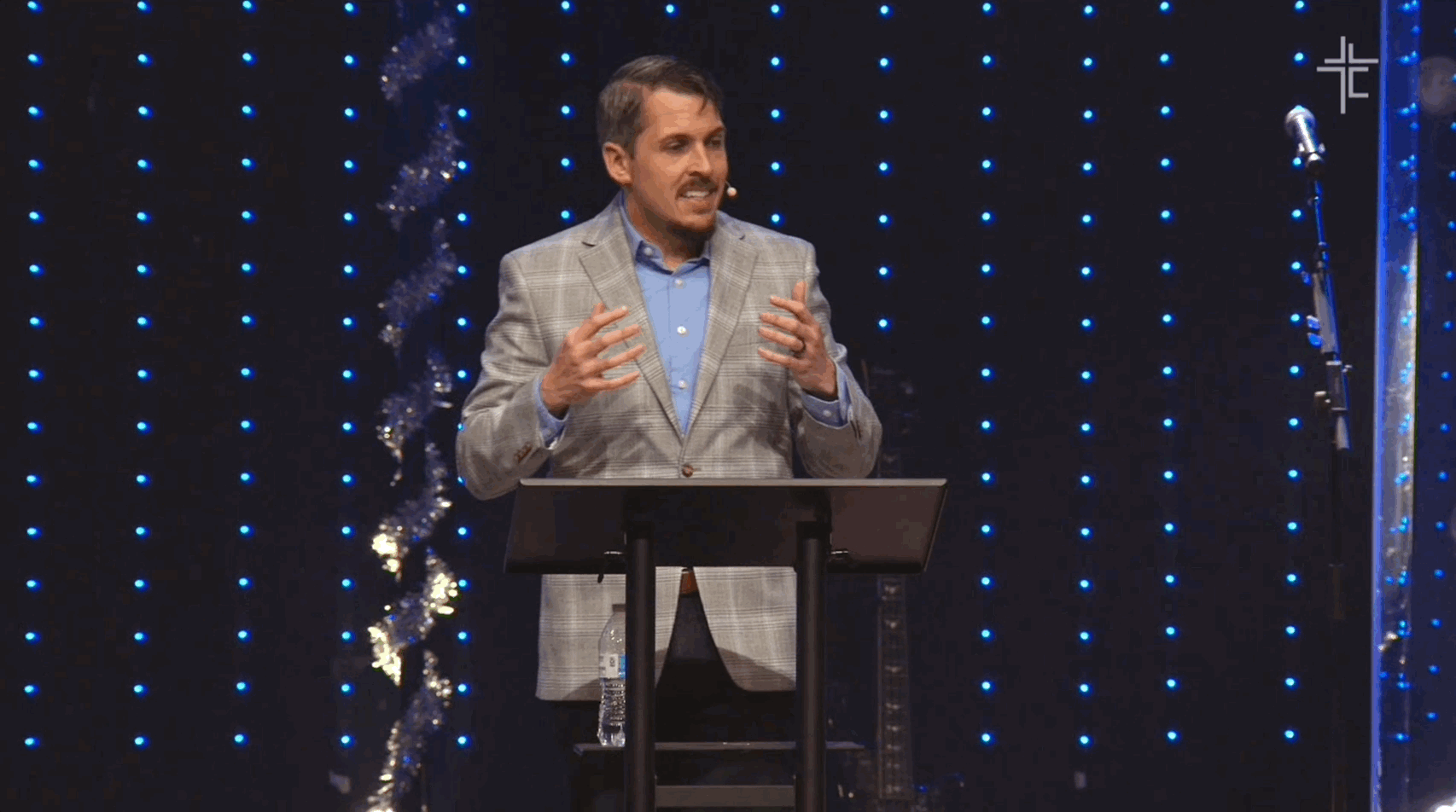 Main camera shot of pastor speaking on stage