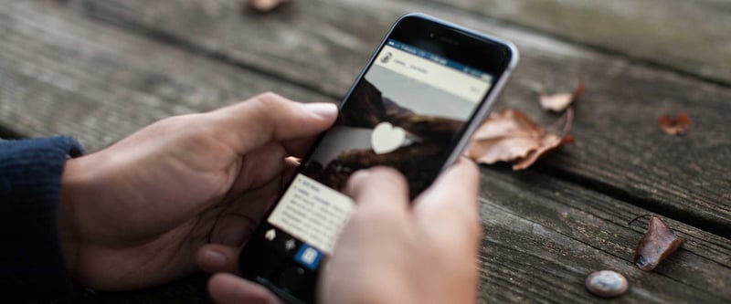 close up of hands holding a mobile phone
