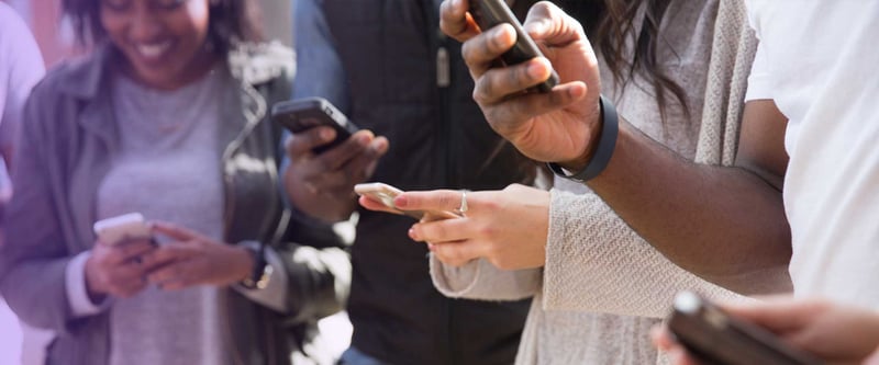 group of people using mobile phones and social media