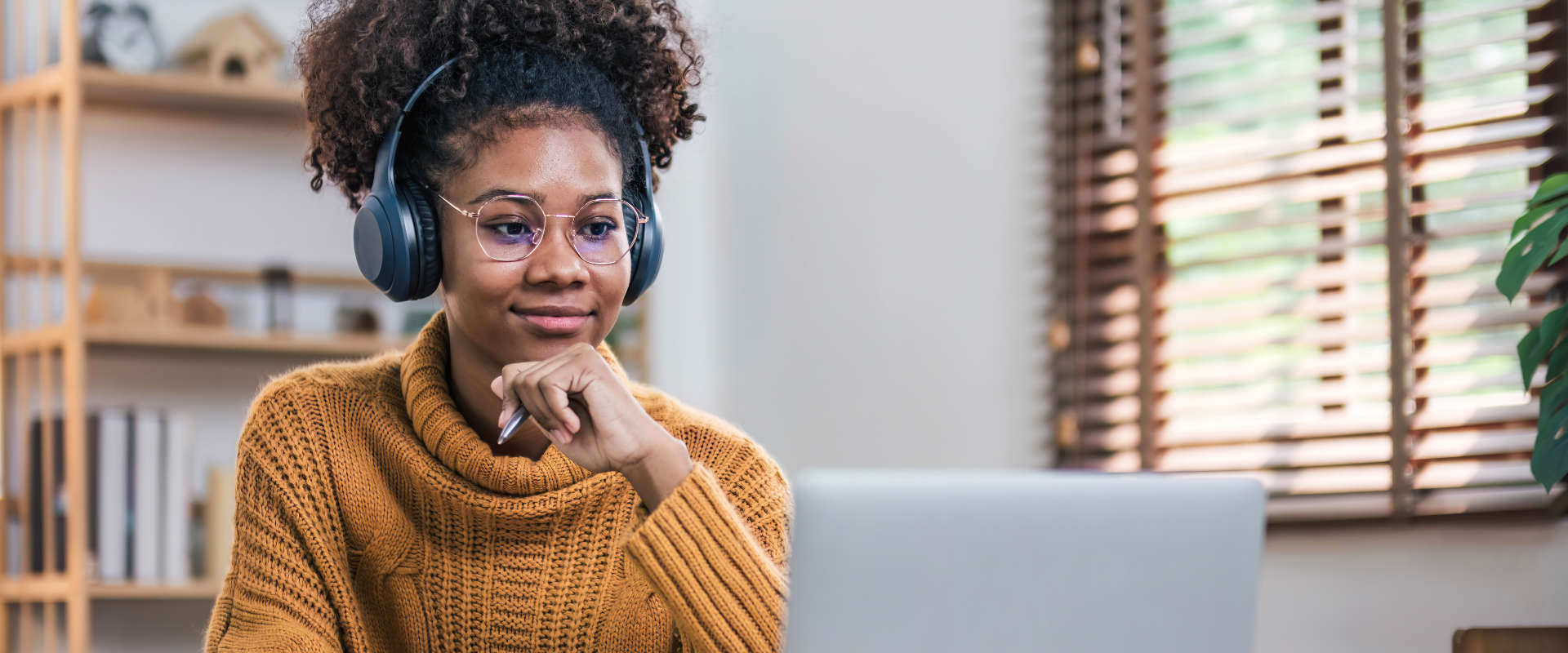 Woman watching live stream with headphones