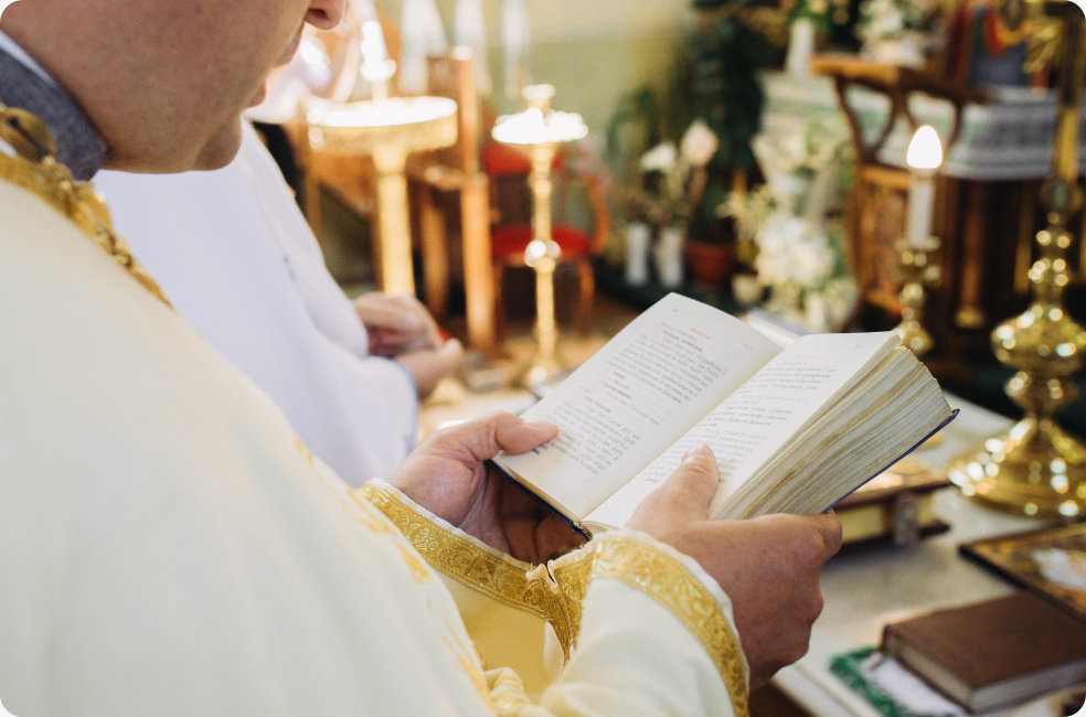 Priest reading from the bible