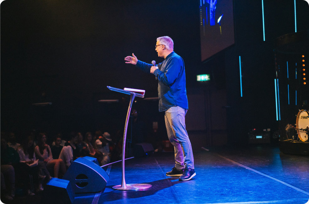 Pastor speaking onstage