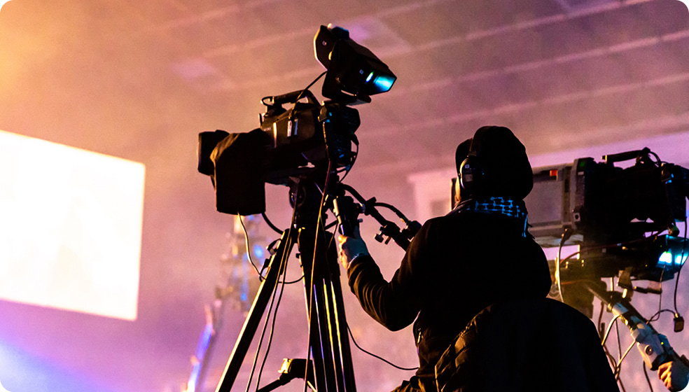 Two camera operators filming something