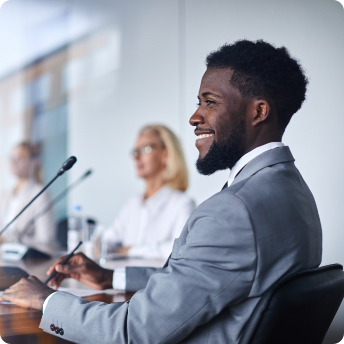 Man speaking at a government meeting