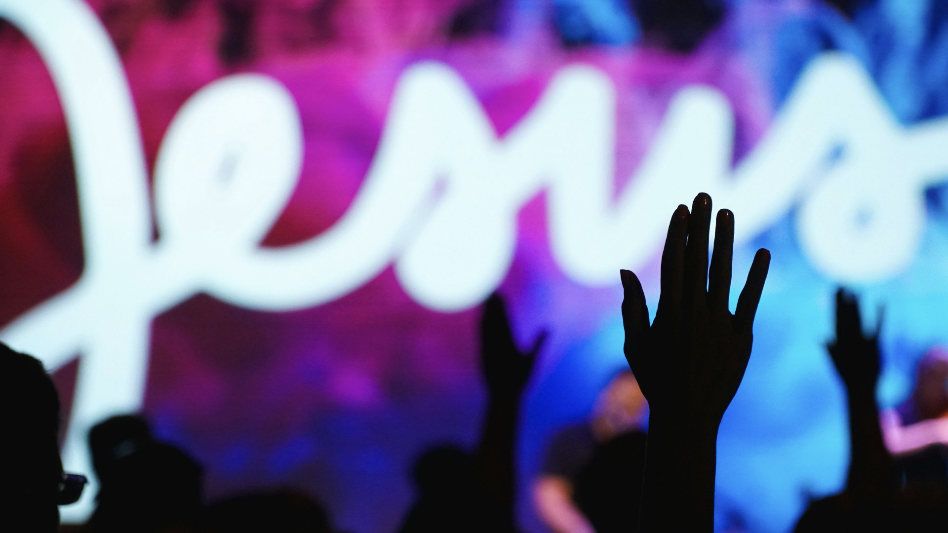 Hands up worshiping at a church service