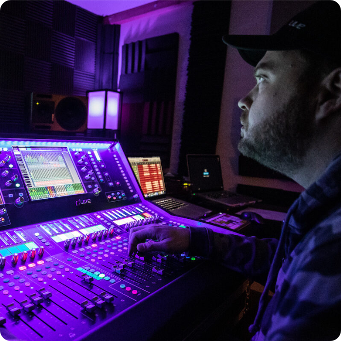 Audio engineer using an Allen & Heath mixer during a live event
