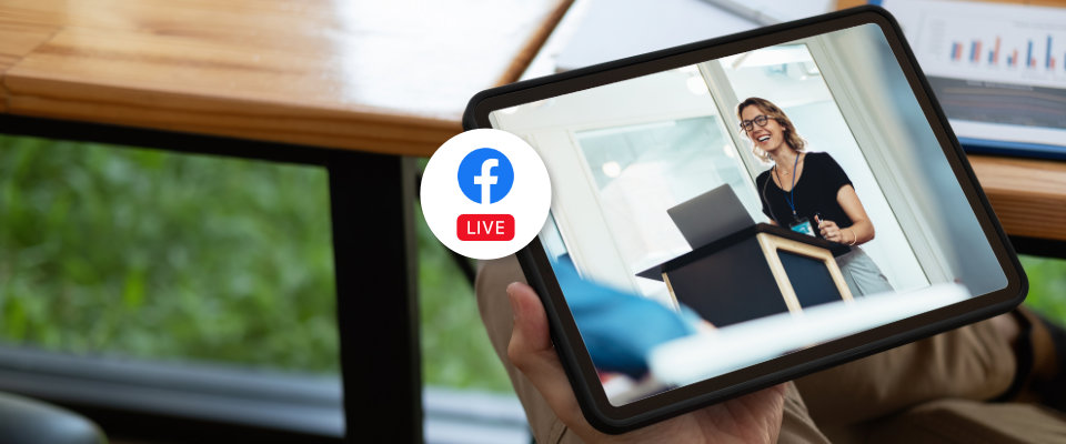 Person watching a Facebook Live stream of a speaker on a tablet