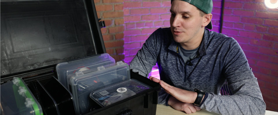 Videographer showing gear organization in a storage case