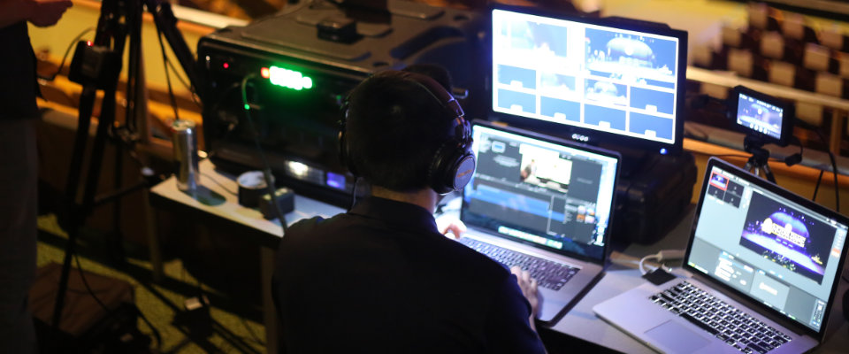 Video producer monitoring a live multi-cam setup