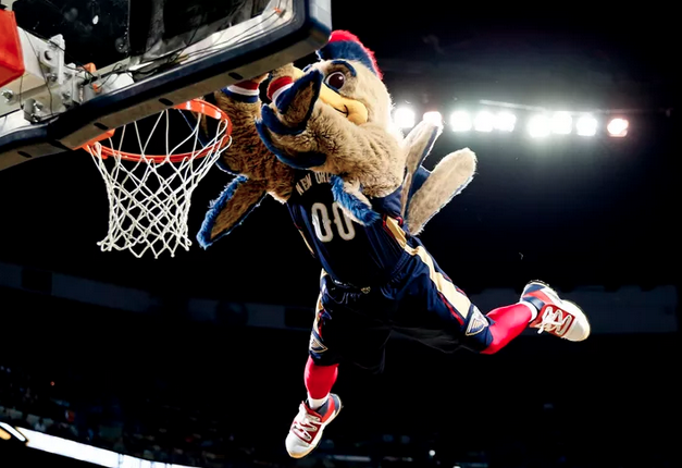 Team mascot dunking a basketball